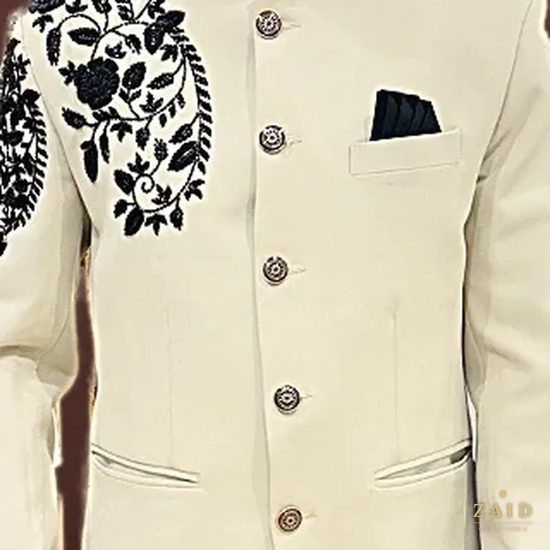Close-up of black bead embroidery on a cream bandhgala